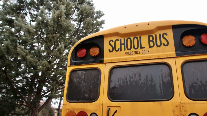 A school bus parks outside the New Mexico State Capitol in January 2023.