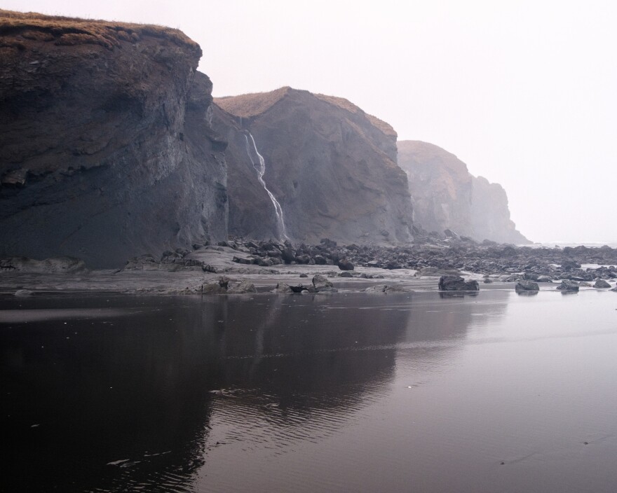 Fossil Beach is a popular recreation area for Kodiak residents, with imposing cliffs on either side of the beach. (Brian Venua/KMXT)