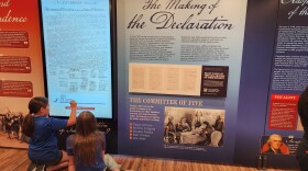 Children participate with an interactive exhibit on the Freedom Truck celebrating America's 250th birthday.