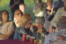 A woman looks at the crowd behind her in surprise. 
