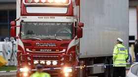 Police move a semitruck container where the bodies of 39 people were discovered in Grays, England, last week.