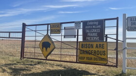 Gates in the tallgrass prairie preserve warn visitors of loose buffalo.