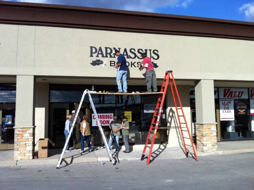 Parnassus in progress: Workers put some final touches on the front of the bookstore. The store is named after Mount Parnassus, home of literature and learning in Greek mythology.