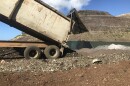FILE - A truck dumps automobile scraps at Waimanalo Gulch Landfill in 2020.