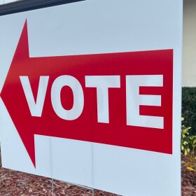 Vote sign with arrow pointing to the left