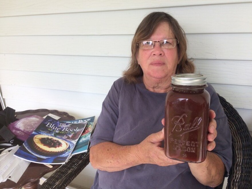 Jean Billips with a 2019 season jar of apple butter.