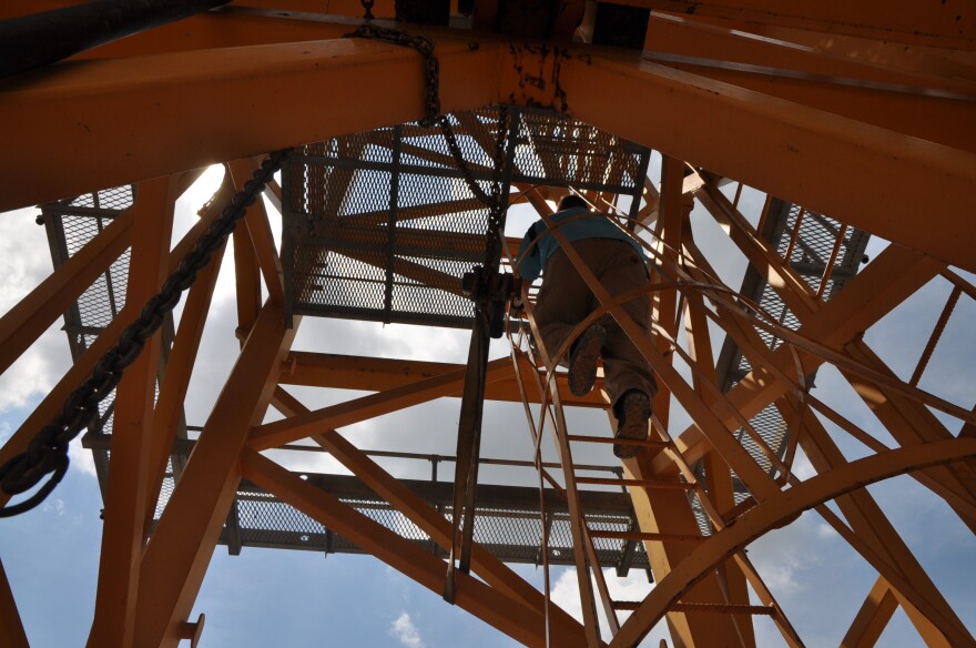 Miller starts his climb into the air-conditioned cab on top of the 400-foot crane, where he'll stay until his shift ends at 10pm. 