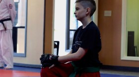 Skyler Wampler listens to directions at a martial arts lesson in Bloomington.