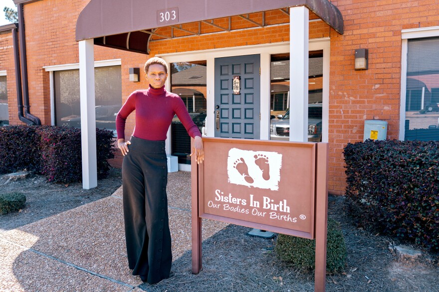 Getty Israel stands outside of Sisters in Birth — the clinic she runs in Jackson, Mississippi.