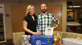 Chris and Emily Fricker with their CuddleCot. (Courtesy of Emily Fricker)