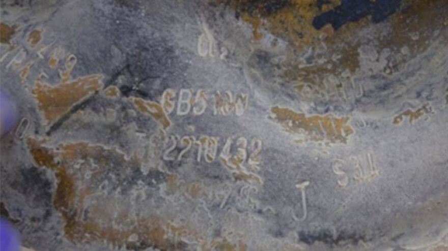 Markings and stamps are clearly visible on cylinders that were likely used in a chemical weapons attack, including "CL2" — denoting chlorine gas.