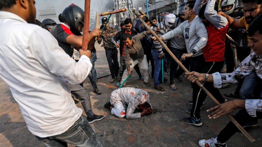 A Muslim man was beaten Monday in New Delhi by a mob of people reportedly shouting pro-Hindu slogans. This image has been widely circulated on social media.