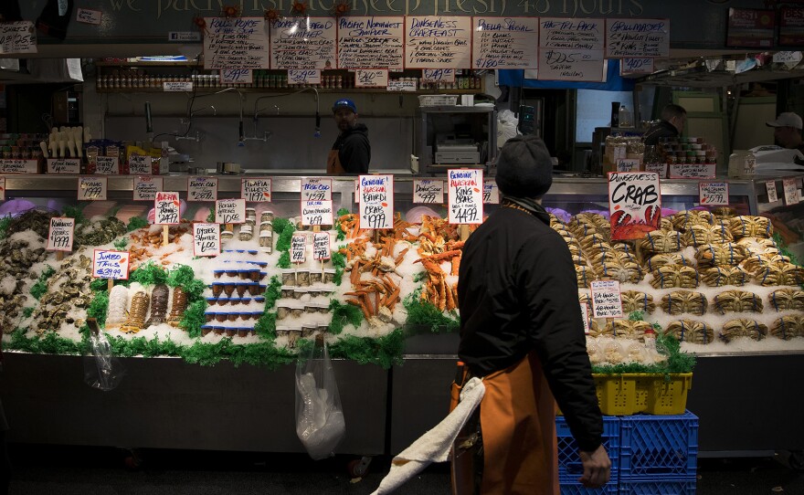 Seafood is displayed at Pike Place Fish Market on Tuesday, January 9, 2018, at Pike Place in Seattle.