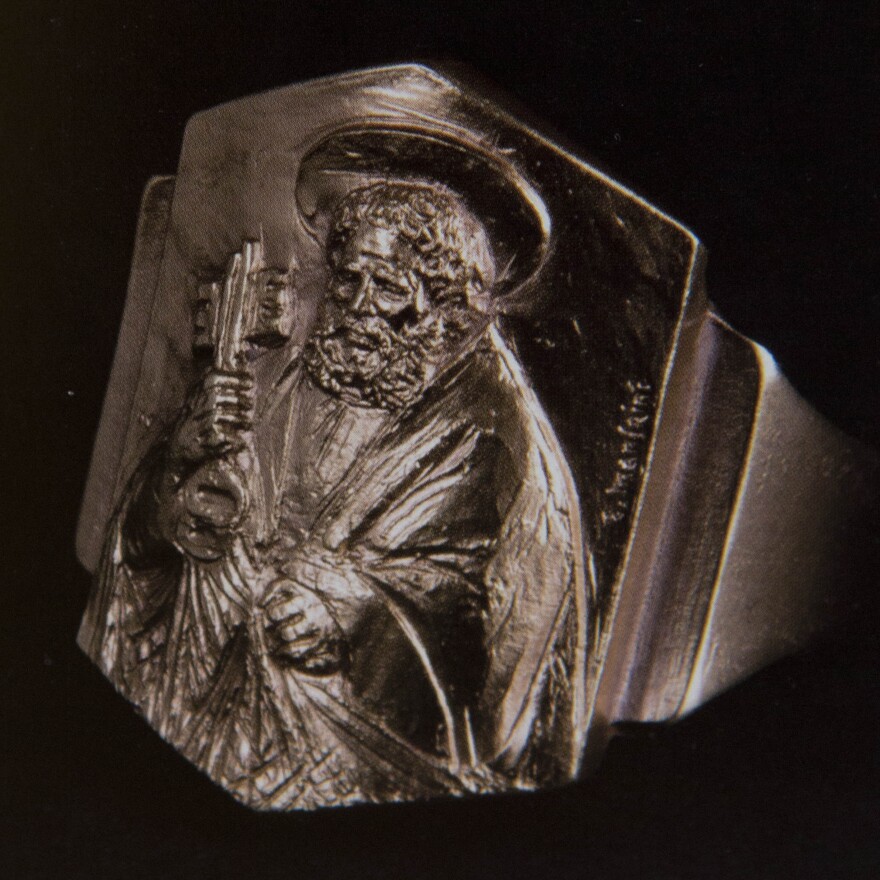 The Fisherman's ring, which Pope Francis will now wear. The name and image honor St. Peter, a fisherman and the first pope. The ring is fashioned in gold-plated silver.