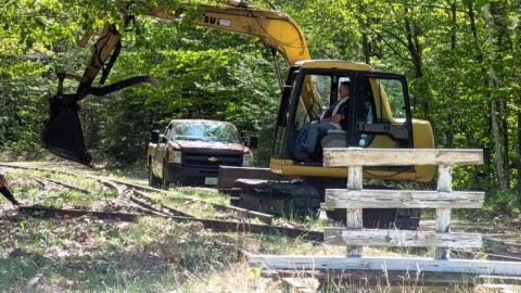 Larry Sprague, a trustee Andover Historical Society, took this photograph of an excavator clearing out an area to put barriers up on the Potter Place section of the Rail Trail in Andover.
