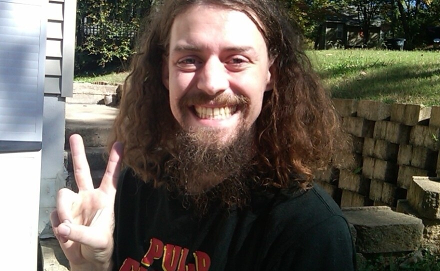 Jason Dow says this is the smile he tried to make for his mug shot last week. It landed him in lockdown for 12 hours.