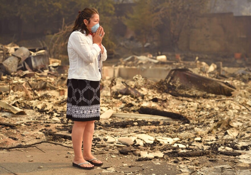 Homeowner Martha Marquez looks over her burned home in Santa Rosa, Calif., on Oct. 10, 2017. (Josh Edelson/AFP/Getty Images)