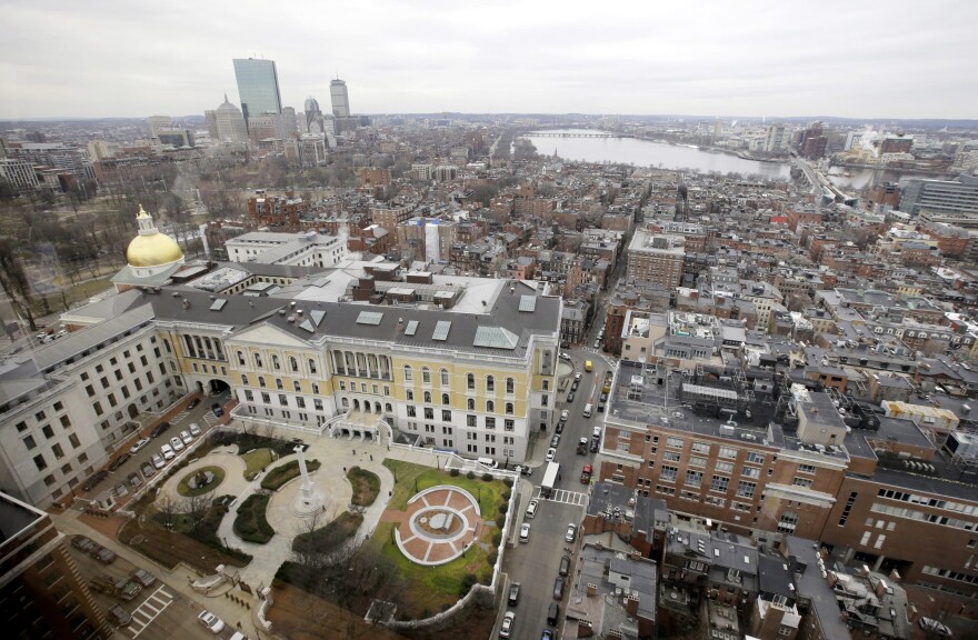 A portion of the Boston Skyline is seen through a window from the office of Massachusetts Attorney General's office.