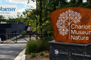 The newly renovated Charlotte Museum of Nature, formerly known as Discovery Place Nature and the Nature Museum, appears ready to open, but county commissioners heard Tuesday that Discovery Place owes the county $14.6M.