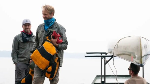 Brothers John Connelly, left, and Tom Connelly after they evacuated the Boundary Waters Canoe Area Wilderness with the help of tow boat driver Willy Vosburgh on Thursday at Moose Lake near Ely, Minn. | MPR