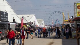 San Antonio Stock Show & Rodeo visitors walk around the livestock and cattle barns.