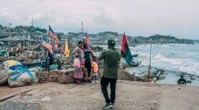 Tourists pose for pictures at the Cape Coast Castle on August 18, 2019. Visitors are flocking to Ghana as it marks the "Year of Return" to remember the 400th anniversary of the first slave ship landing in Virginia. (Natalija Gormalova/AFP/Getty Images) 