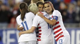 United States' Tobin Heath, second from right, is congratulated on her goal by Mallory Pugh (11), Megan Rapinoe and Alex Morgan (13) during the first half of a SheBelieves Cup soccer match against Brazil in Tampa, Fla., March 5, 2019. (Mike Carlson, File/AP)