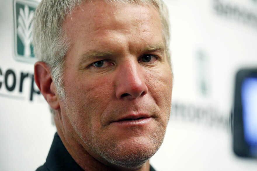 Former NFL quarterback Brett Favre speaks with reporters prior to his induction to the Mississippi Hall of Fame in Jackson, Miss., Saturday, Aug. 1, 2015.