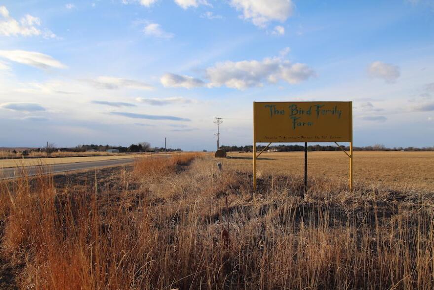 A sign reading Bird Family Farm