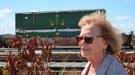 Fort Pierce Mayor Linda Hudson looks on at a rail yard where train cars full of trash are shipped in from Miami-Dade County. 
