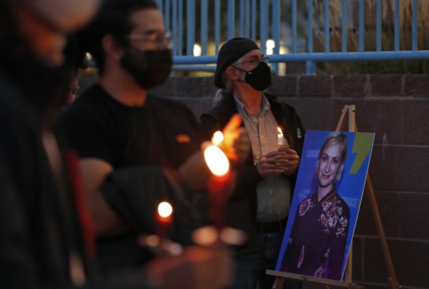 New Mexico residents attend a candlelight vigil to honor cinematographer Halyna Hutchins in Albuquerque, N.M. Saturday, Oct. 23, 2021. Hutchins was fatally shot on Thursday on the set of a Western filmed in Santa Fe, N.M.