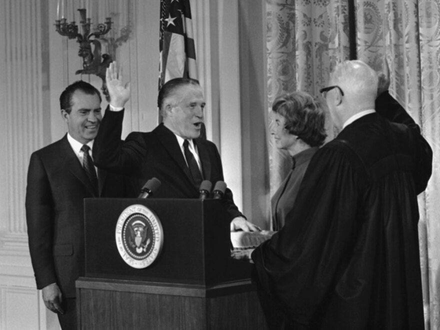 George Romney is sworn in as secretary of Housing and Urban Development in 1969 at the White House. The oath was administered by Chief Justice Earl Warren and attended by Romney's wife and President Nixon.