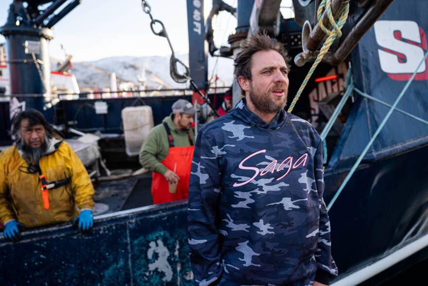 Captain Jake Anderson stands next to his boat Saga on Jan. 12 in Dutch Harbor. Behind are his crew members Mac White and Joe Gomez.