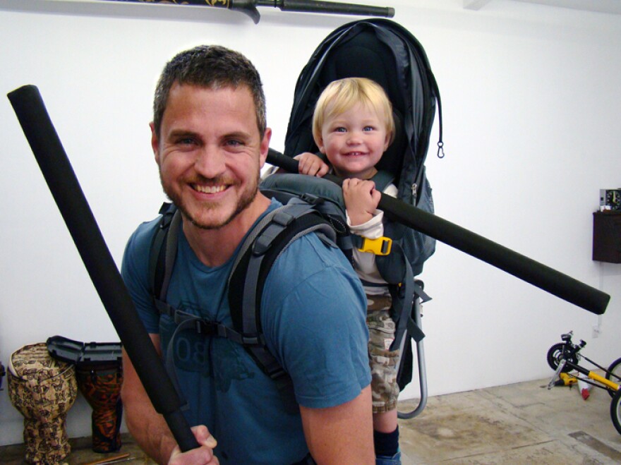 Sam Sheridan, shown here with his son Asa, is an amateur boxer and MMA fighter. He has worked in construction in Antarctica and as a cowboy and farmhand in Montana.