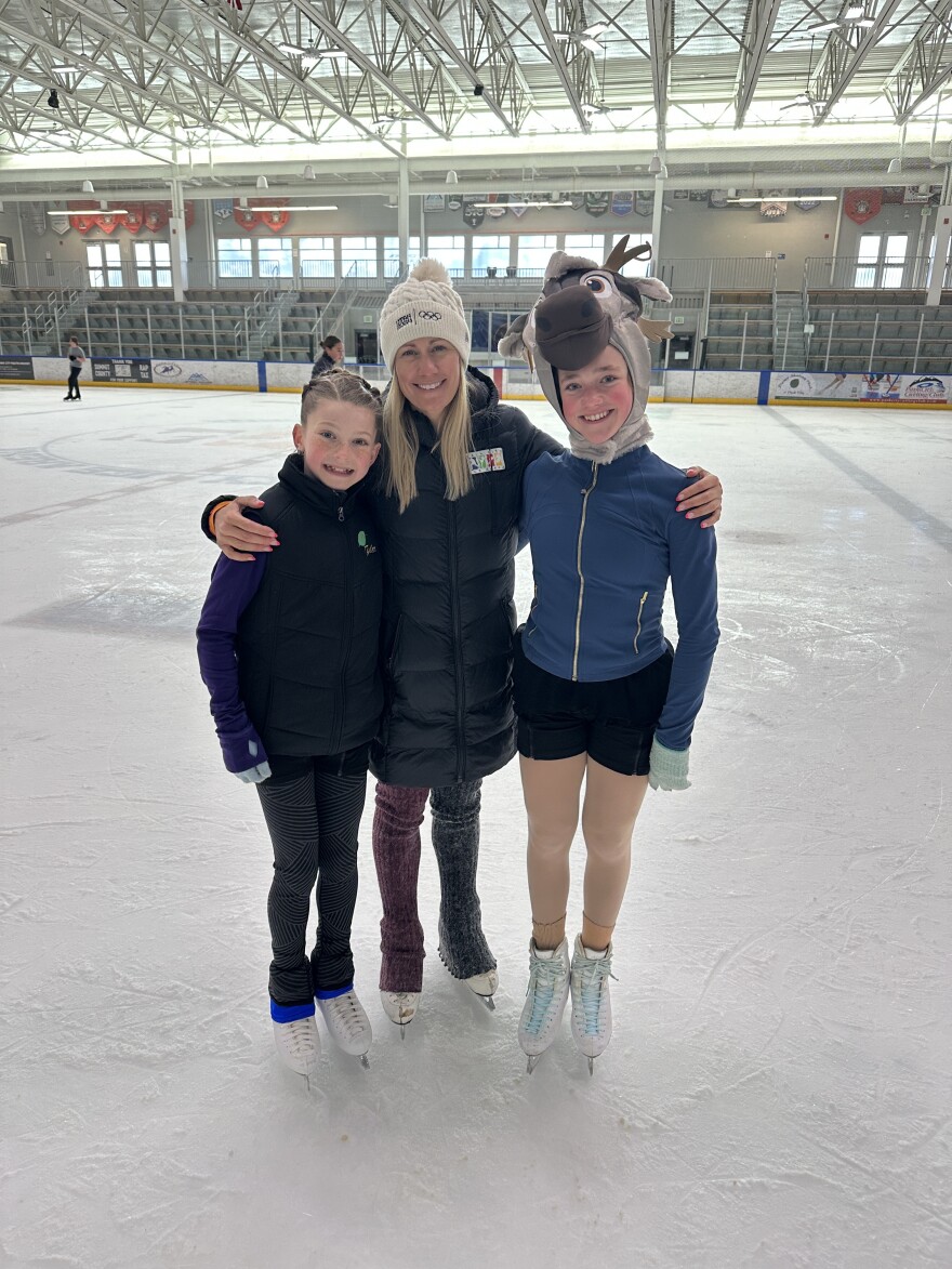 Head coach Stephanie Chace Bass with figure skaters at Park City Ice Arena