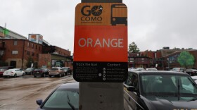A photo of a Go COMO orange route sign at the Wabash Bus Station.
