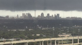 Dark storm clouds hang over downtown San Antonio as another round of severe weather moves across the region Wednesday, as seen from the Medical Center area.