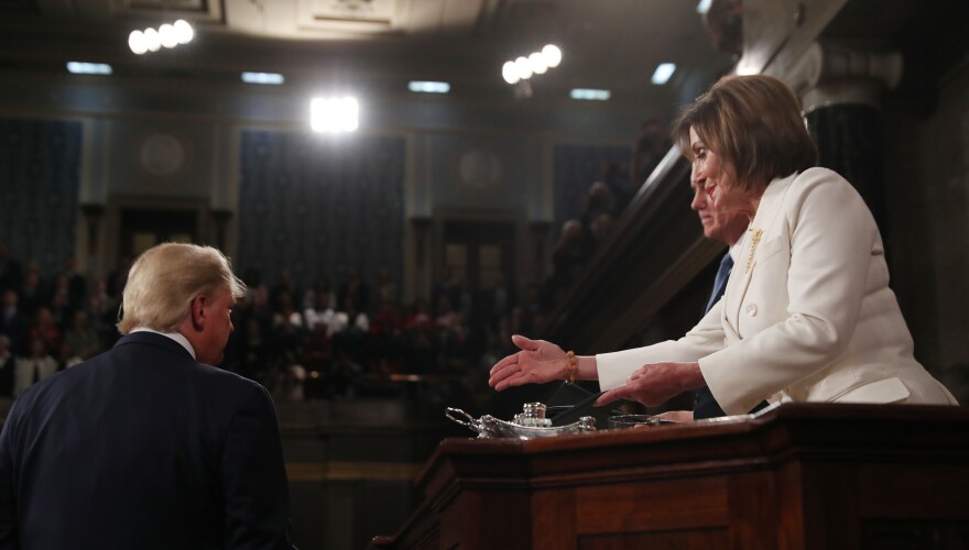 President Trump turns away as House Speaker Nancy Pelosi reaches out to shake his hand before the State of the Union address.