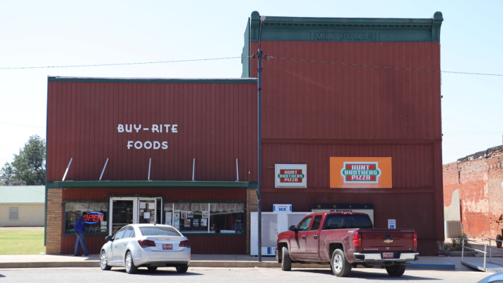 Buy-Rite Foods is a red building situated in the middle of Pond Creek, Oklahoma. Inside, shoppers will see whirring refrigerators, rows of food and a hot food counter in the back.