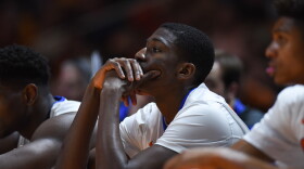 As the final seconds of the game clock expire and the Volunteer's claim a 83-69 victory over the Gators, Florida's DeVon Walker (1) watches from the bench. (Greenberry Taylor/WUFT News)