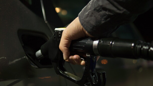 Pumping gasoline for a vehicle.