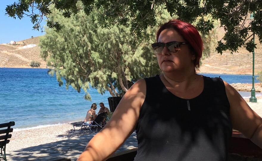 Tilos Mayor Maria Kamma sits outside a seaside cafe. "We wanted to evolve from simply a green island into a clean-energy island," she says. "We wanted to do something substantive."