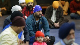 Men attend Sunday services at the Gurudwara Singh Sabha of Washington, a Sikh temple in Renton, Wash., Sunday, March 5, 2017, south of Seattle.