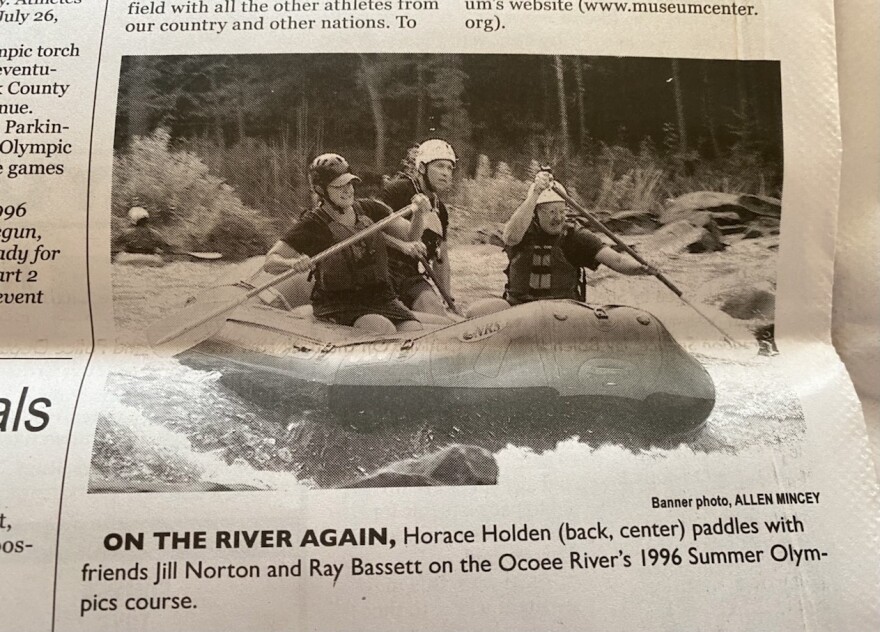 A snapshot of a Cleveland Daily Banner photo of Horace Holden, UTC’s Jill Woodruff and Ray Bassett on a raft on the Upper Ocoee.