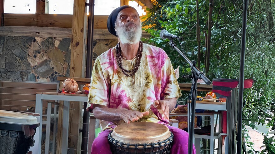 Delroy “Ital” Anthony plays the drums at a cultural event on the island of St. John.