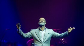 This picture taken on March 22, 2018 shows US singer Brian McKnight performing during a concert in Surabaya. (Juni Kriswanto/AFP via Getty Images)