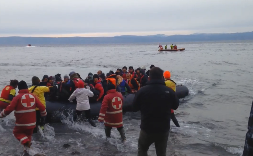 Migrants from Afghanistan arrive on a rocky beach in northern Lesbos, assisted by Greek Red Cross volunteers, Spanish lifeguards and other international volunteers.