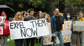 Protesters gathered in a courtyard outside the meeting of the Cornell Board of Trustees on Friday.