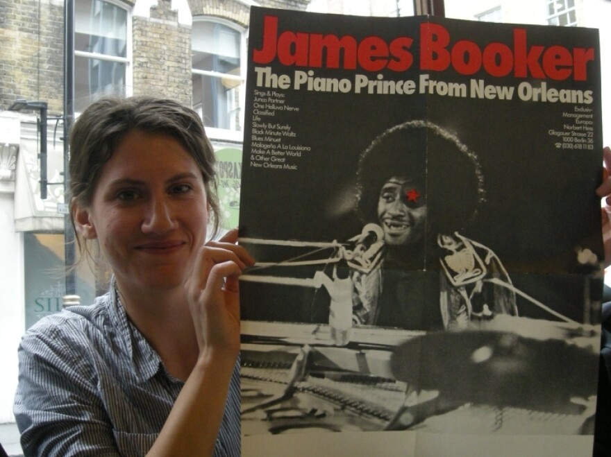 Filmmaker Lily Keber holds the poster for her upcoming documentary, <em>Bayou Maharajah.</em>