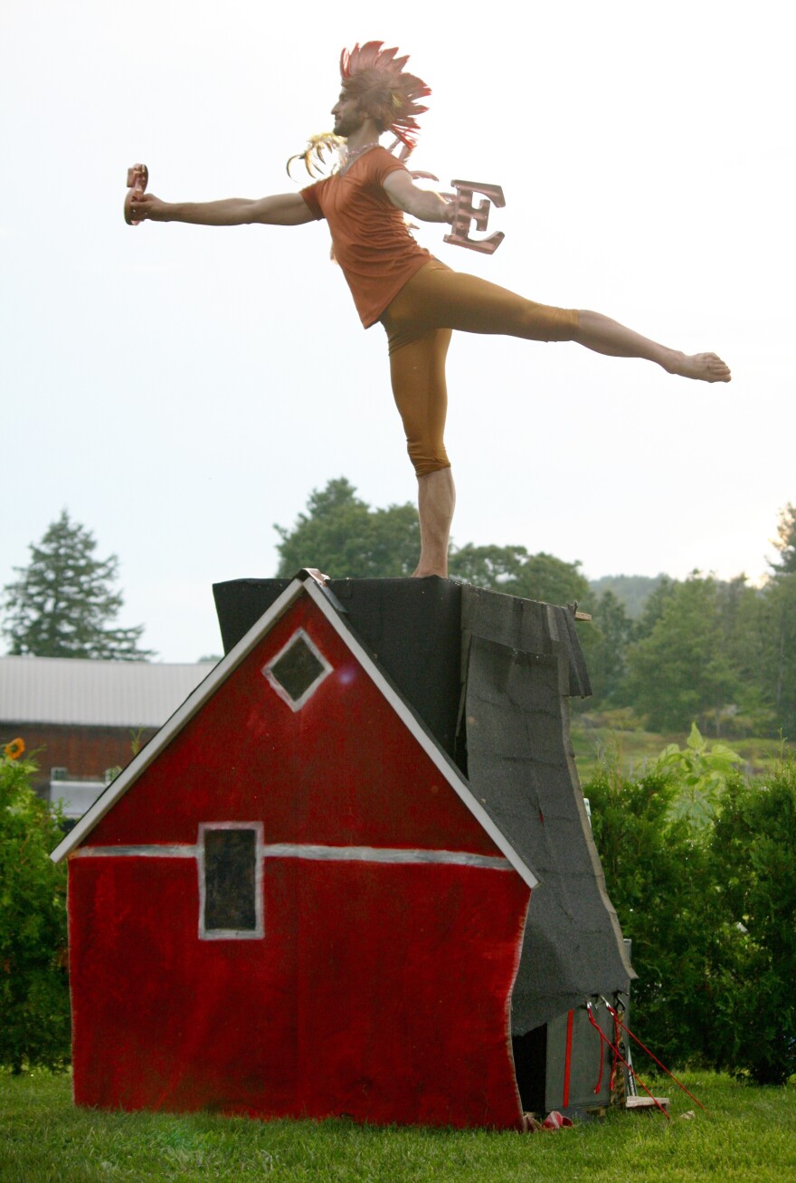 At a farm in Charlotte, Vt., Chatch Pregger dances as a weathervane rooster. Pregger, who directs the Farm to Ballet project, modified classical ballet dances to depict the changing seasons on a New England farm.